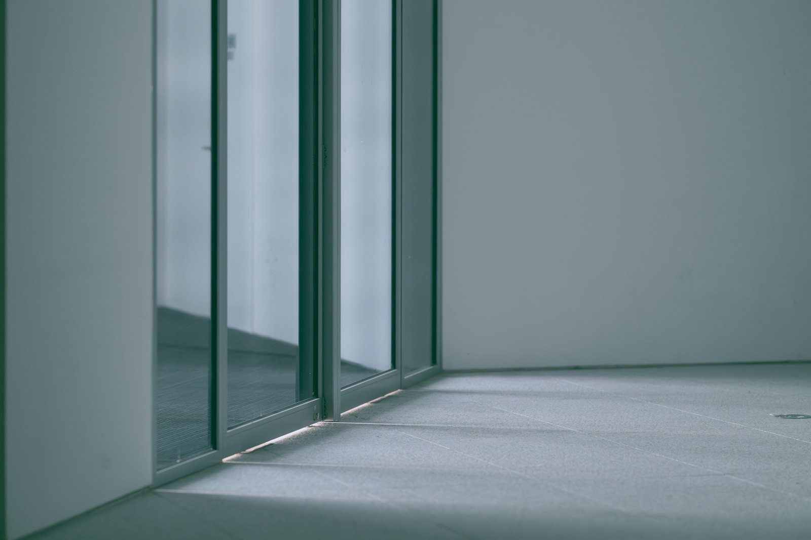 Close-up of a sliding glass door and its clean bottom track