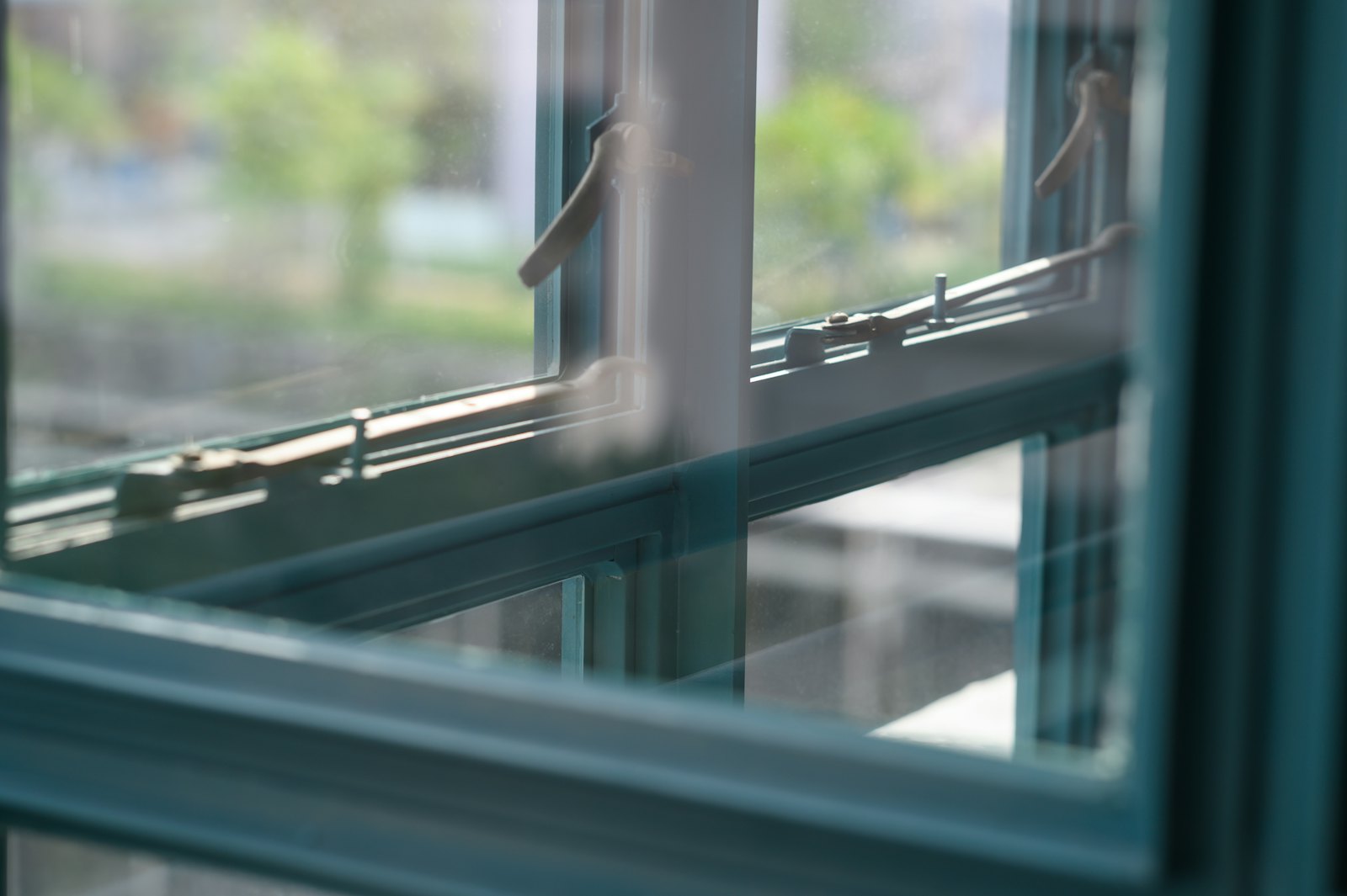 Close-up of window frames, latches and sill